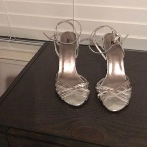 Silver wedge heels.